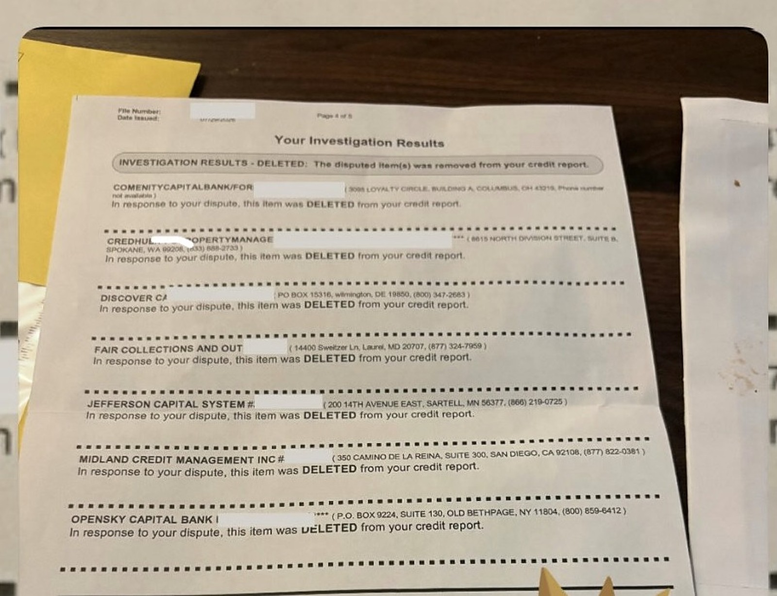 The client’s own investigation-results letter on a desk, seven disputed items each marked DELETED